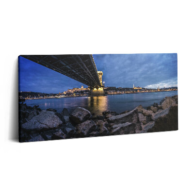 Obraz canvas 100x50 cm Skalnaté pobřeží pod mostem
