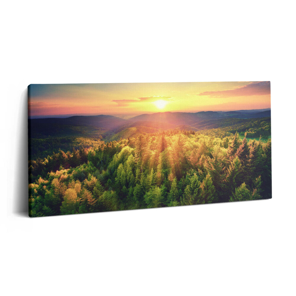 Obraz z fotografie na plátně 140x70 cm Západ slunce nad zalesněnými kopci