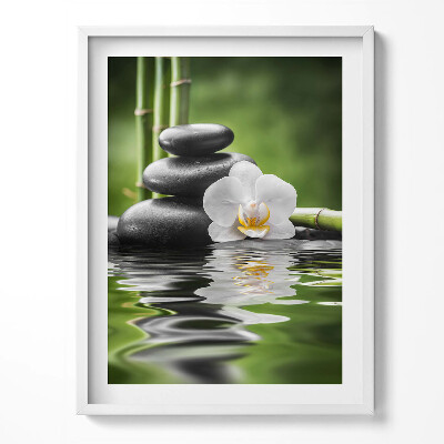 Obraz v rámu Zen - bambusové kameny a květina na vodě
