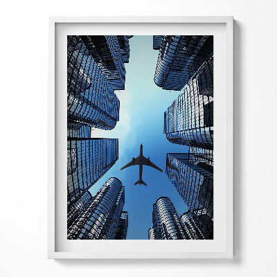 Obraz v rámu Letadlo nad budovami