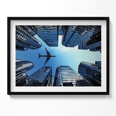 Obraz s rámem Letadlo nad budovami