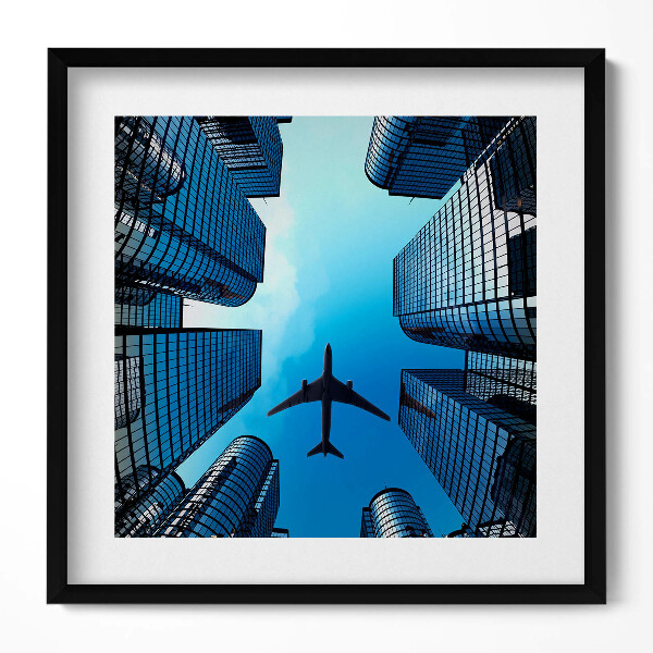 Obraz v rámu efektivní Letadlo nad budovami
