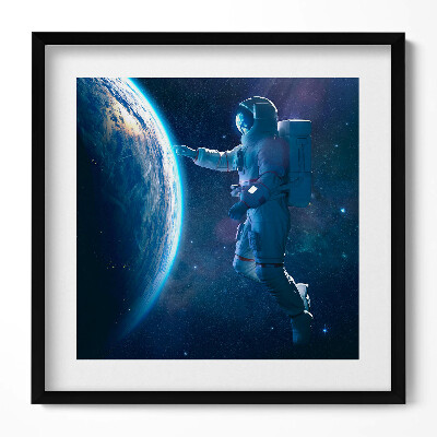 Obraz v rámu efektivní Kosmonaut a planeta Země