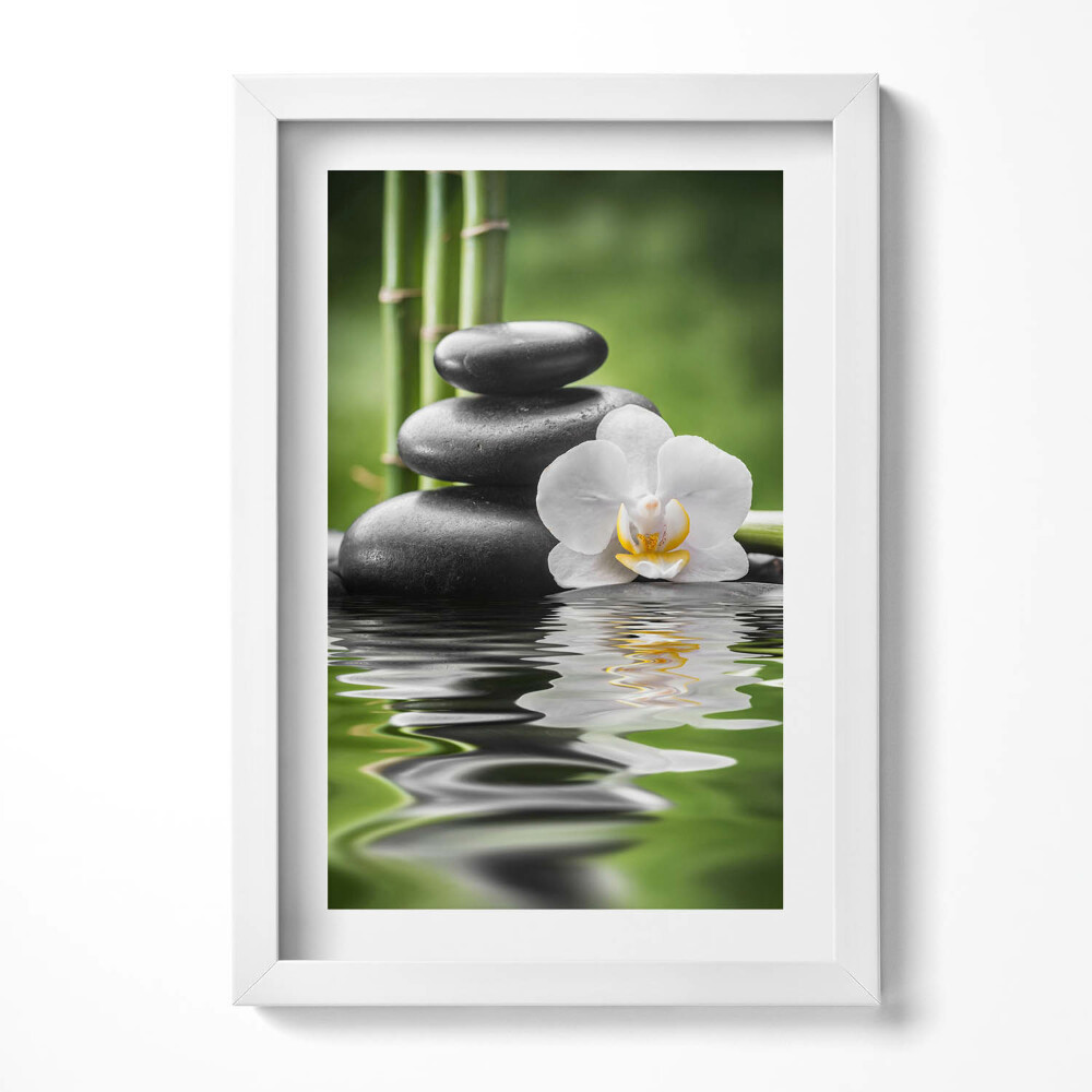 Obraz s rámem elegantní Zen - bambusové kameny a květina na vodě