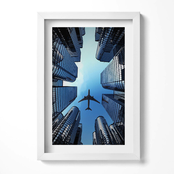 Obraz s rámem elegantní Letadlo nad budovami