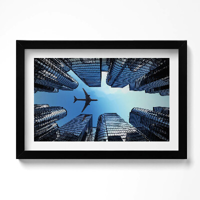 Obraz s rámem dekorativní Letadlo nad budovami